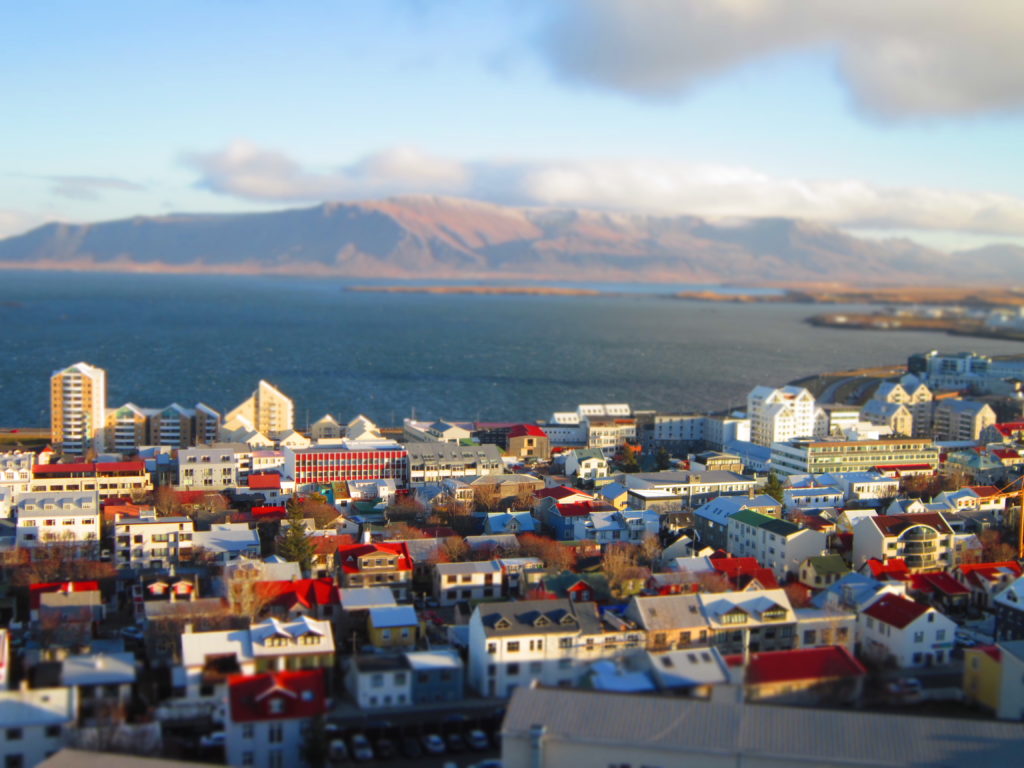 Reykjavik, Iceland birds eye view high mountains houses sea