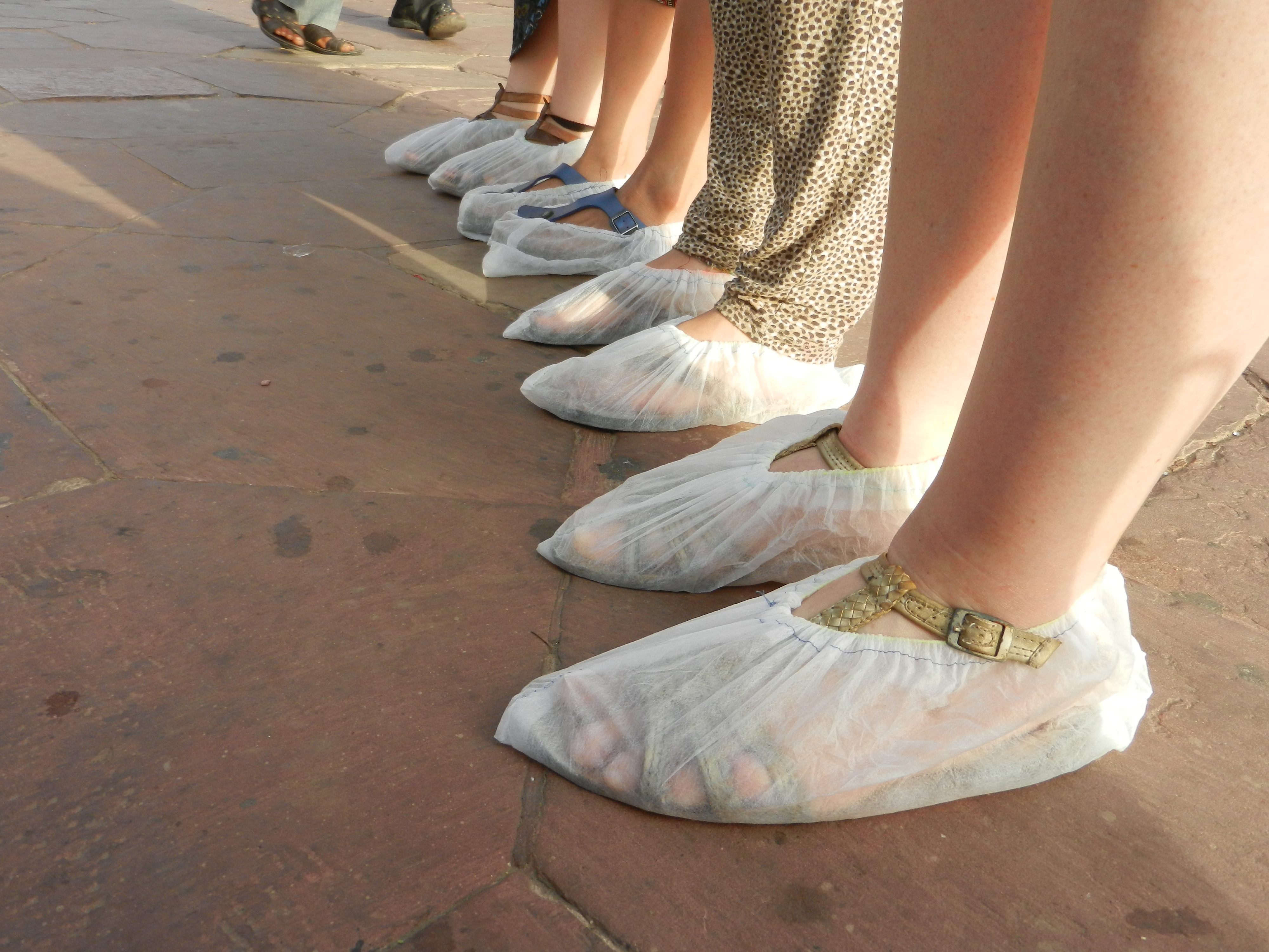slippered feet at the Taj Mahal