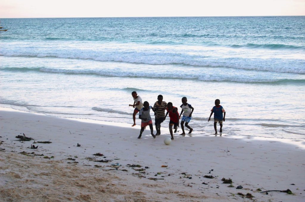 Diani beach Kenya boys football playing