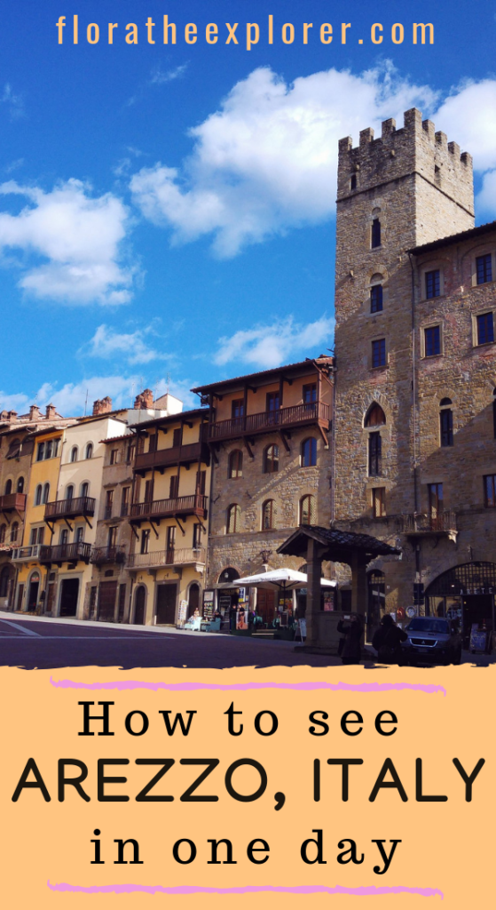 A row of sunny buildings in an Italian plaza. Text overlay reads: "How to see Arezzo, Italy in one day'